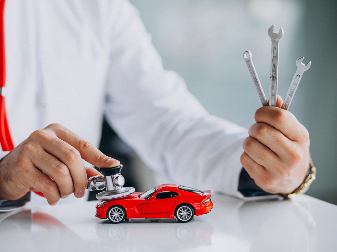 Car doctor with stethoscope in a car showroom